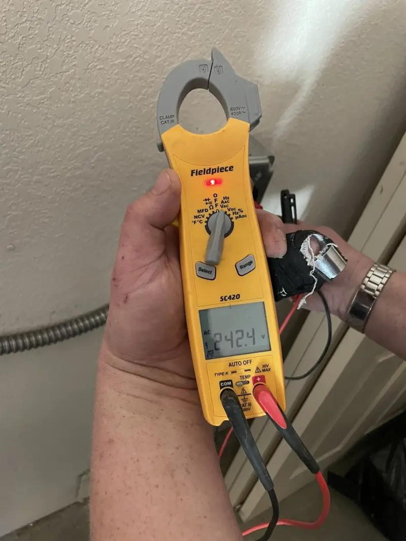 Voltage testing with clamp meter during Ceiling Fan Installation in Fort Scott